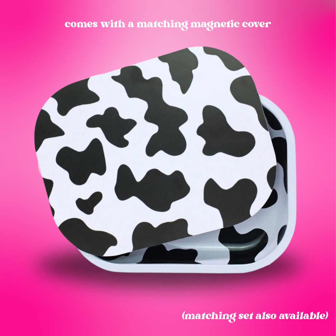 Cow print product case on a pink background with text about a matching magnetic cover.