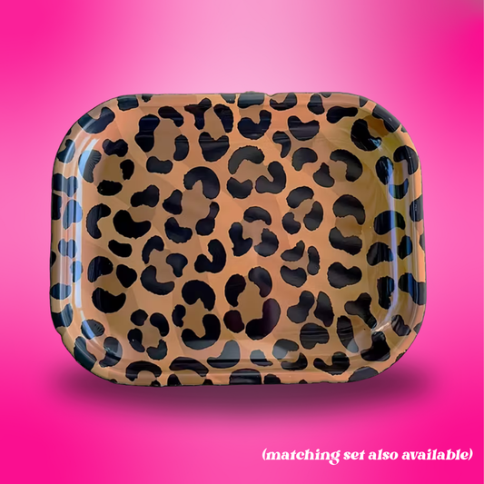 Leopard print tray on a pink background